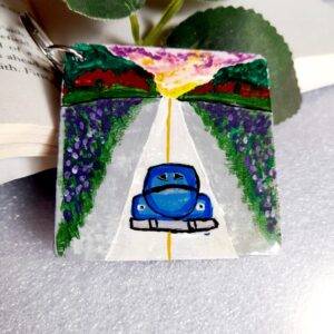 Hand painted keychain designed with vibrant colors and road trip themes