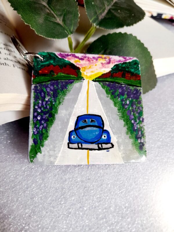 Hand painted keychain designed with vibrant colors and road trip themes